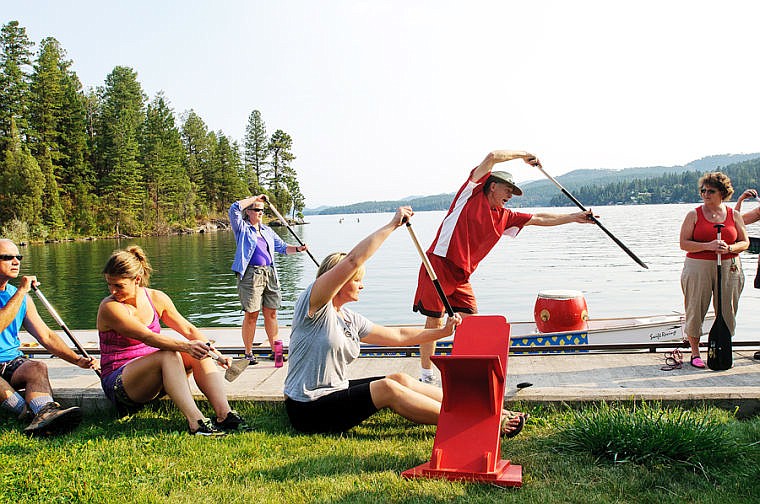 &lt;p&gt;Doug Coats, behind in red, demonstrates proper paddling technique Wednesday evening during a Dragonboat practice for teams Flathead DragonFlies and Major Threat in Somers Bay on Flathead Lake. Aug. 28, 2013 in Somers, Montana. (Patrick Cote/Daily Inter Lake)&lt;/p&gt;