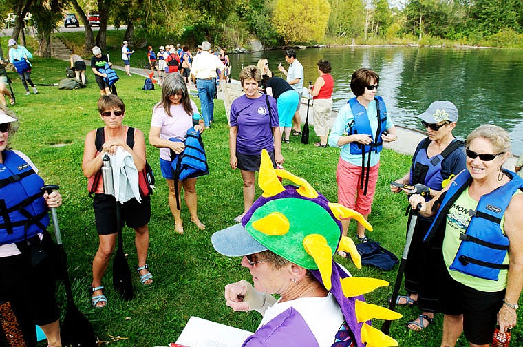 &lt;p&gt;Cindy Coats organizes a group of first-time paddlers Wednesday evening during a Dragonboat practice for teams Flathead DragonFlies and Major Threat in Somers Bay on Flathead Lake. Major Threat is the four boat team put together by the Flathead Community Foundation. Aug. 28, 2013 in Somers, Montana. (Patrick Cote/Daily Inter Lake)&lt;/p&gt;