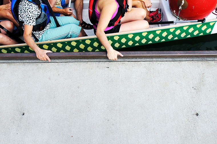 &lt;p&gt;Paddlers hold on to the dock Wednesday evening during a Dragonboat practice for team Flathead DragonFlies in Somers Bay on Flathead Lake. Aug. 28, 2013 in Somers, Montana. (Patrick Cote/Daily Inter Lake)&lt;/p&gt;