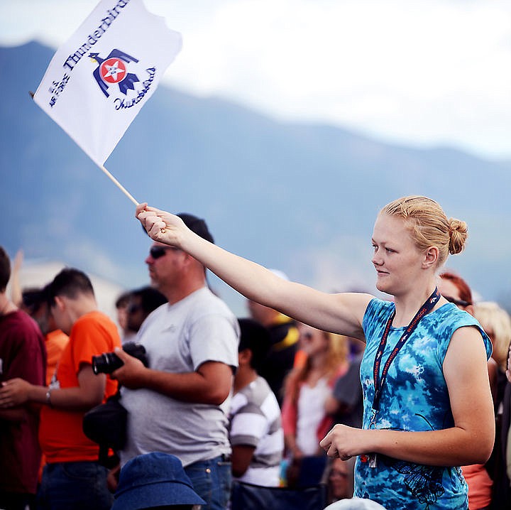 &lt;p&gt;Danielle Dorman, 24, of Kalispell waves a flag and cheers as the Thunderbirds prepare for take off on Saturday, August 30 at the Mountain Madness Air Show. (Brenda Ahearn/Daily Inter Lake)&lt;/p&gt;