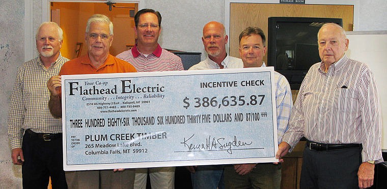 &lt;p&gt;From left, Greg Grace of Plum Creek, Ken Sugden and Mark Johson of Flathead Electric, Ken Benson and Tom Ray of Plum Creek and Earl Messick of the Flathead Electric Board of Trustees were on hand as the co-op presented a check to the timber company for energy efficiency work at Plum Creek&#146;s Columbia Falls sawmill.&lt;/p&gt;&lt;p&gt;&lt;/p&gt;