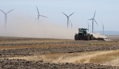 &lt;p&gt;A farmer plows a field near wind turbines owned by Chicago-based Exelon Corp. outside of Mountain Home, Idaho on Thursday, Aug. 2, 2012. State electricity regulators aiming to set the course for Idaho's renewables industry for years to come will hold hearings next week on long-running and bitter disputes between utilities like Idaho Power Co. and independent wind, solar and biogas developers. The Idaho Public Utilities Commission has scheduled three days of hearings starting Tuesday, to be attended by a crowd of lawyers, utility executives and environmentalists. (AP Photo/John Miller)&lt;/p&gt;