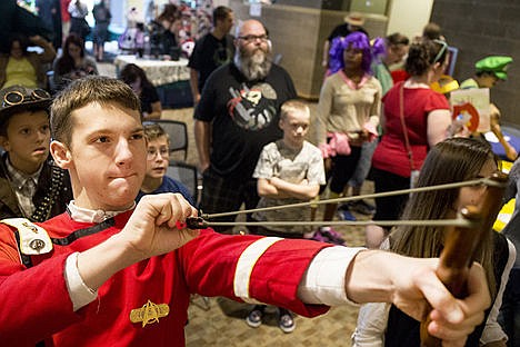 &lt;p&gt;Dressed in Star Trek attire, Kyle Desimone of Coeur d&#146;Alene aims up a slingshot at targets at the Zelda Slingshot Challenge on Saturday at the first-ever Coeur d&#146;Con comic con at the Coeur d&#146;Alene Public Library.&lt;/p&gt;