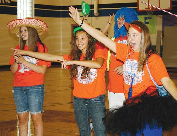 Student volunteers lead sixth graders in a cheer for Frontier Middle School during orientation Tuesday.