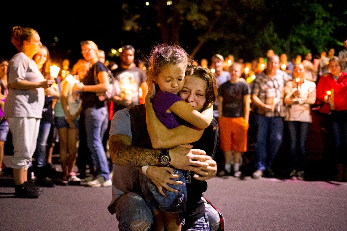 &lt;p&gt;Dacia Cheyney and Antonio Wilburn, parents of Maliki Wilburn, hug Maliki's cousin Leticia Hewitt, 6, during a candlelight vigil for Maliki on Monday evening at Crowley Park in Spokane.&lt;/p&gt;