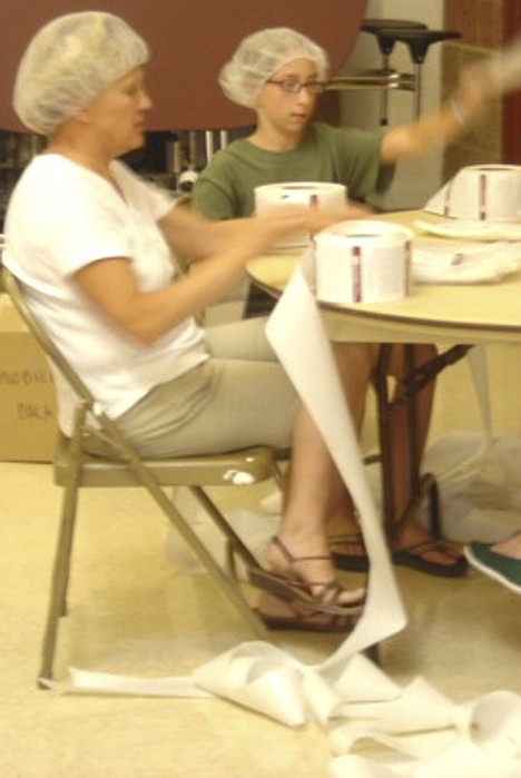 &lt;p&gt;Rathdrum 12-year-old Maddie Snyders, right, recently assisted with the packing of potato manna packs for children in need around the world. Here she helps with the labeling process.&lt;/p&gt;