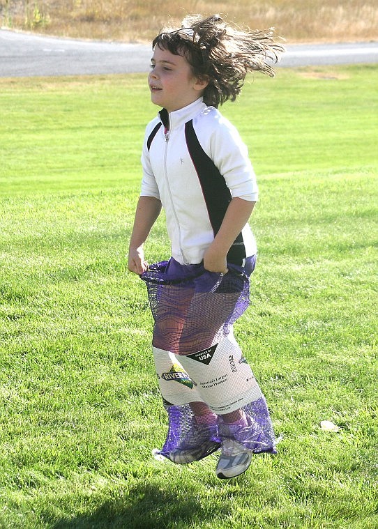 &lt;p&gt;Molly Patko takes the lead in a potato sack race during the
first annual Fall Fitness Fun Day Saturday morning.&lt;/p&gt;