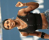 Agassi advances, peer Martin retires