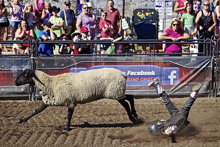 &lt;p&gt;JEROME A. POLLOS/Press Emma Seckler, 5, takes a tumble off of a sheep and onto the dirt of the &quot;mutton busting&quot; arena Thursday at the North Idaho Fair.&lt;/p&gt;