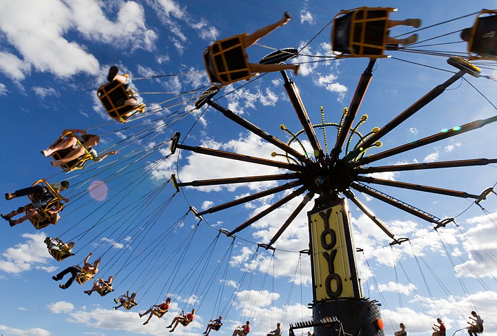 &lt;p&gt;SHAWN GUST/Press Riders zoom in circles in their swings while riding the YoYo a the fair.&lt;/p&gt;