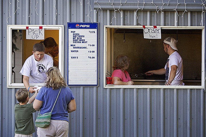 &lt;p&gt;JEROME A. POLLOS/Press Ammon Weeks, 16, delivers a customer an elephant ear Thursday from a concession stand near the food court.&lt;/p&gt;