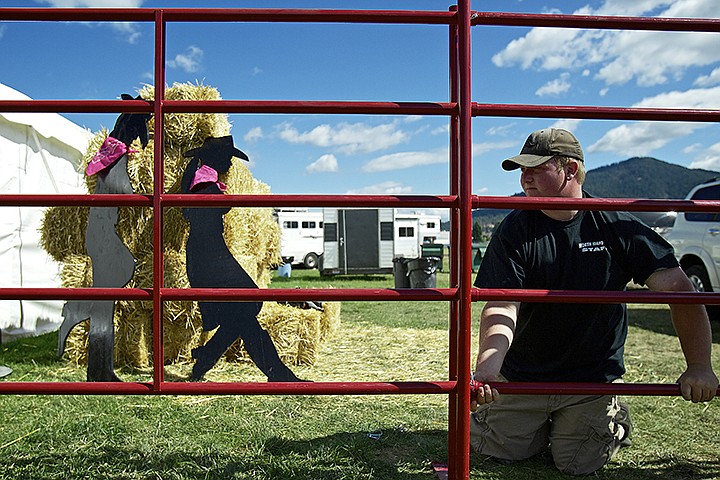 &lt;p&gt;JEROME A. POLLOS/Press Dan Dingman helps construct a fence before the arrival of rodeo participants and spectators Friday.&lt;/p&gt;