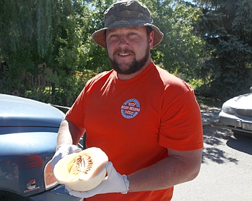 &lt;p class=&quot;p1&quot;&gt;Faus Silverhale carves up some Hettick cantaloupe for tasting.&lt;/p&gt;