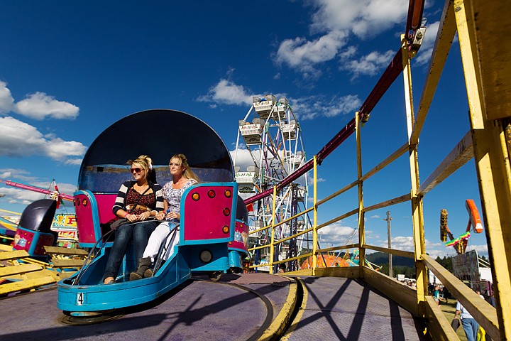 &lt;p&gt;SHAWN GUST/Press Sierra Sauer, left, and Brandy Freer ride the Super Tilt during a visit to the North Idaho Fair from the Silver Valley.&lt;/p&gt;