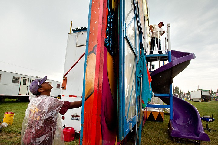 &lt;p&gt;SHAWN GUST/Press Jesus Rivera, left, and Darin Webster work on setting up a house of mirrors Tuesday on the midway at the Kootenai County Fairgrounds in Coeur d'Alene. The Kootenai County Fair and Rodeo opens today and runs through Sunday.&lt;/p&gt;