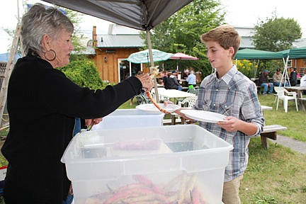 &lt;p&gt;PEO volunteer Stephanie Klement services up a spiny snack for Davis Smith, 12, of Finley Point.&lt;/p&gt;