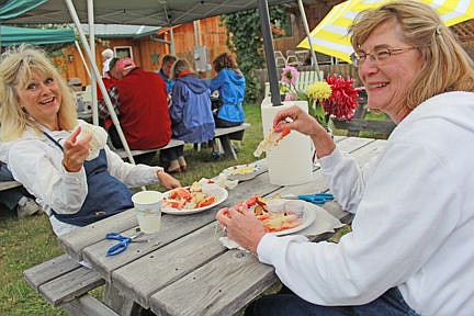 &lt;p&gt;PEO volunteers Jeanne Seeley, left, and Jeanne Doepke enjoy the fruits of their labor.&lt;/p&gt;