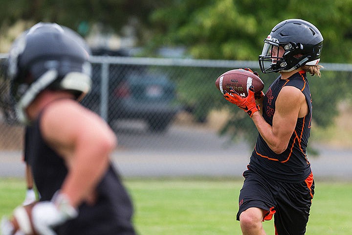 &lt;p&gt;Senior receiver Zach Hillman catches the ball during a route drill.&lt;/p&gt;