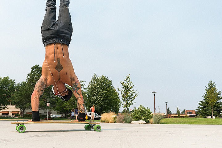 &lt;p&gt;Steve Seiver rides on a skate board while doing a handstand Thursday in McEuen Park in Coeur d&#146;Alene. Seiver has applied to the next season of American Ninja Warrior and, if accepted, plans to donate any winnings to the Kootenai County Police and Fire Memorial Foundation.&lt;/p&gt;