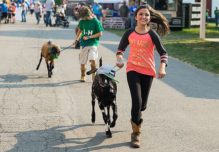 &lt;p&gt;Kylie Duce, 11, of Post Falls, jogs with her goat Sherman, a Seahawks fan, through the fairgrounds with other members of the Northwest Rangers 4-H group.&lt;/p&gt;