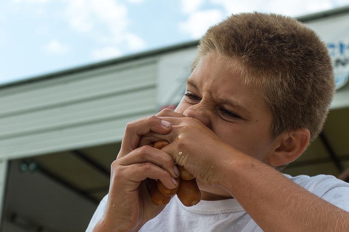 &lt;p&gt;Jeffery Herr attempts to eat five hot dogs at once during the Taste of Rathdrum BBQ Cook-Off at Majestic Park in Rathdrum, ID on Saturday afternoon.&lt;/p&gt;