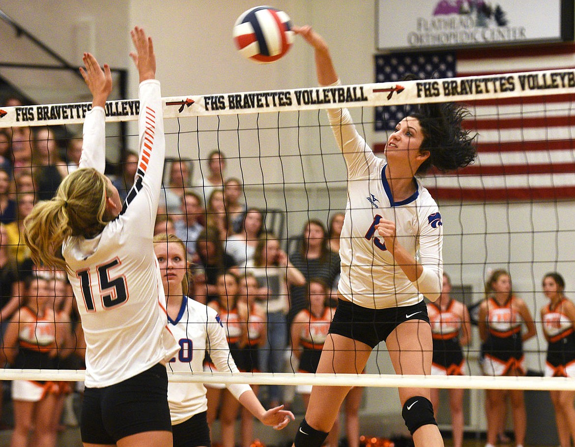 &lt;p&gt;Columbia Falls senior Morgan Stenger smashes the game-winning shot over Flathead senior Sierra Siblerud in the second set at Flathead on Thursday. (Aaric Bryan/Daily Inter Lake)&lt;/p&gt;