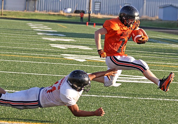 &lt;p&gt;Jack Humphreys avoids a tackle and scores a touchdown during the
Orange and Black Scrimmage this year.&lt;/p&gt;