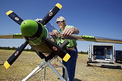 &lt;p&gt;Tommy Valcore affixes the wing on his 1/6th scale, remote control P-51 Mustang as he prepares it for a flight Friday at Farragut State Park.&lt;/p&gt;