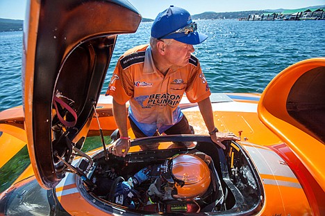 &lt;p&gt;Jeff Kelly of the Beacon Plumbing team kneels beside the cockpit of the teams hydroplane, Miss Beacon Plumbing, as driver J. Michael Kelly prepares to start H1 unlimited heat 1B Saturday. Miss diamond cup came in second place in the heat following close behind Oh Boy! Oberto.&lt;/p&gt;