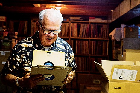 &lt;p&gt;Larry Kmetz thumbs through some of more prized vinyl albums in the basement of his Coeur d'Alene home.&lt;/p&gt;