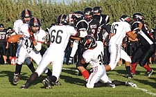 Senior running back J.J. Tanner with the ball. He would be knocked out of the game in the second quarter due to a strained tendon.