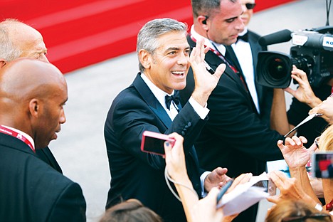 &lt;p&gt;George Clooney signs autographs for fans at the premiere of 'The Ides of March', which opens the 68th edition of the Venice Film Festival in Venice, Italy, Wednesday, Aug. 31, 2011. (AP Photo/Joel Ryan)&lt;/p&gt;