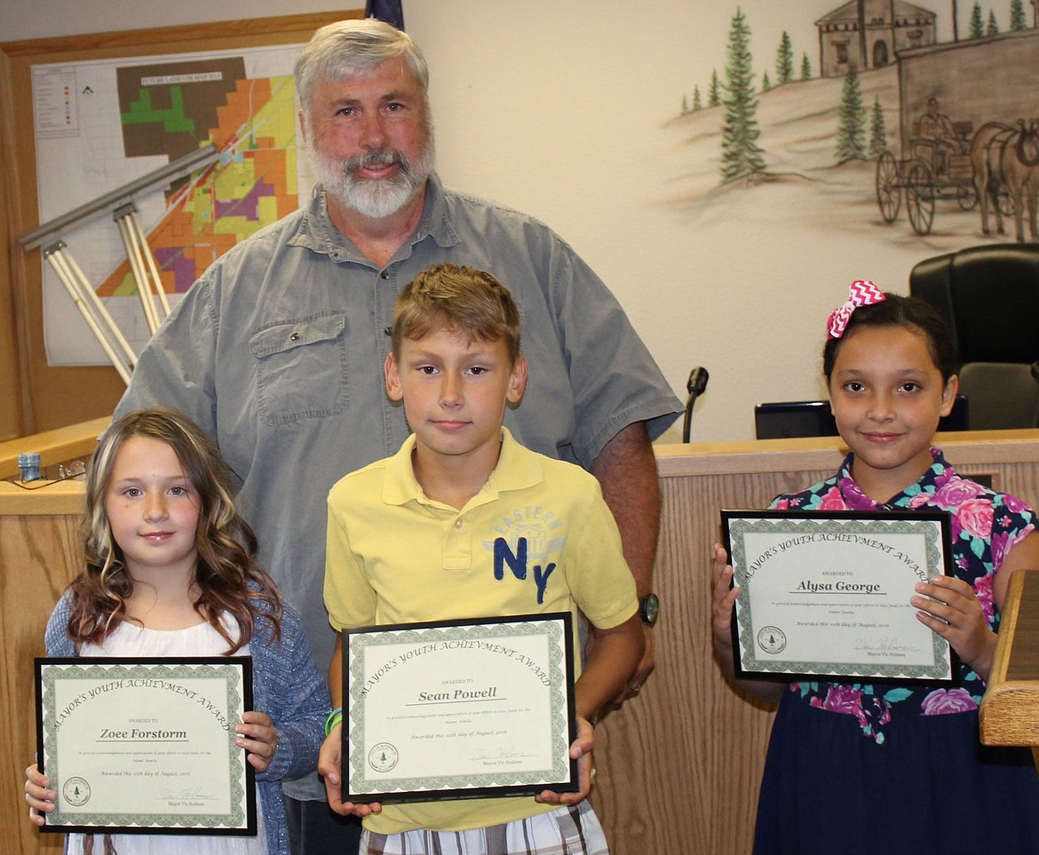 &lt;p&gt;Front from left, Zoee Forstrom, Sean Powell and Alyssa George, students at Betty Kiefer Elementary in Rathdrum, received Mayor's Youth Achievement Awards from Mayor Vic Holmes for running a three-day lemonade stand fundraiser in support of the Adams family.&lt;/p&gt;