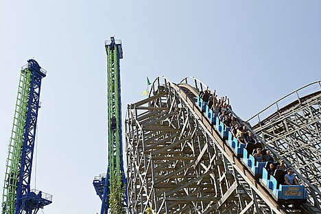 &lt;p&gt;Riders speed down the first drop Friday while riding the wooden roller coaster Tremors.&lt;/p&gt;