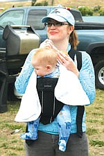 Roman, at five months too young to enjoy some chili, hangs out while his mom Elizabeth Sawyer samples the different entries at Saturday's chili cook-off.