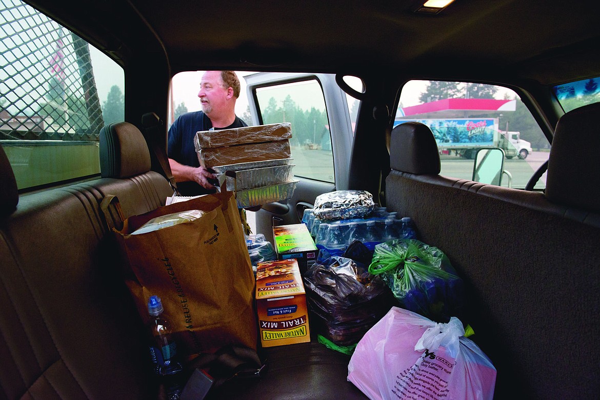 &lt;p&gt;John Harris, the owner of the Lakeside Motel, unloads food and toiletries from a Plains City Fire truck last Wednesday.&lt;/p&gt;