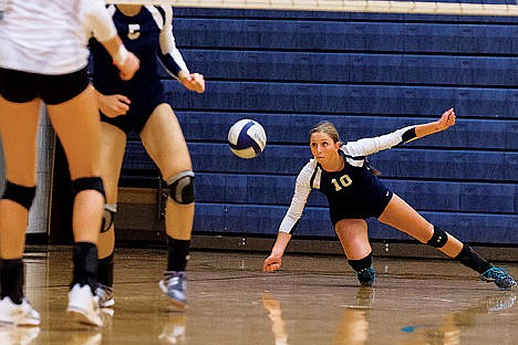 &lt;p&gt;Lake City&#146;s C.C. Cates dives to the floor for the ball in the first set against Coeur d&#146;Alene.&lt;/p&gt;