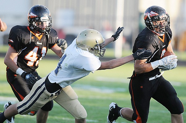 &lt;p&gt;Flathead senior wide receiver Sidney Schenck tries to avoid a
tackle by Big Sky junior defensive back Olan Donaldson during the
first half of Friday&#146;s Class AA football game at Legends
Stadium.&lt;/p&gt;