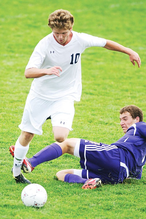 &lt;p&gt;Glacier senior Connor Brandon (10) jumps over the tackle attempt by a Missoula Sentinel defender Tuesday evening during Glacier's home match.&lt;/p&gt;