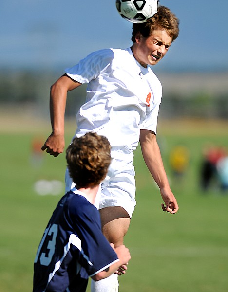 &lt;p&gt;Flathead senior Kieran Cunningham heads the ball during
second-half play against Glacier on Saturday.&lt;/p&gt;