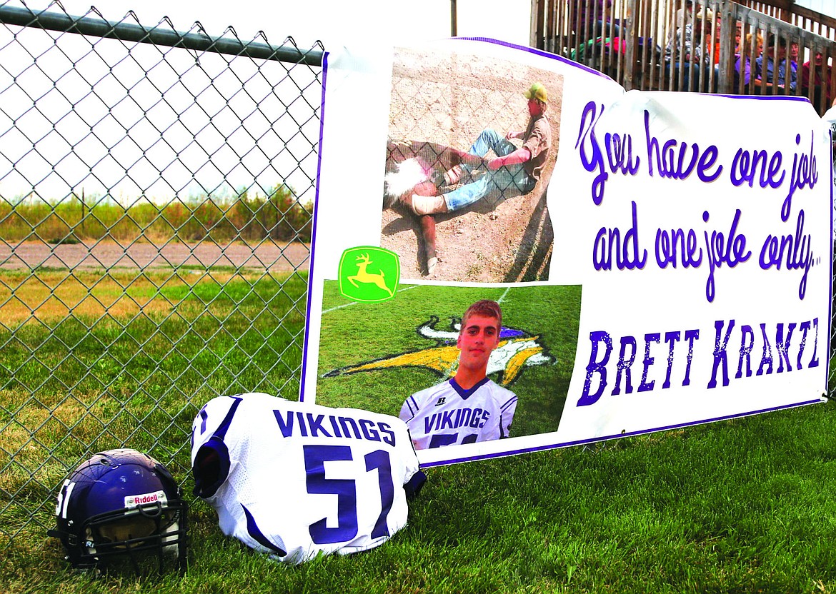 &lt;p&gt;A banner in honor of Brett Krantz hangs on the fence behind the Charlo football team.&lt;/p&gt;