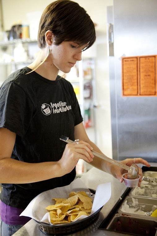 &lt;p&gt;Jessy Foultner fills a cup of salsa for an order of nachos at
the Wrap and Roll Cafe in Kalispell on Friday afternoon.&lt;/p&gt;