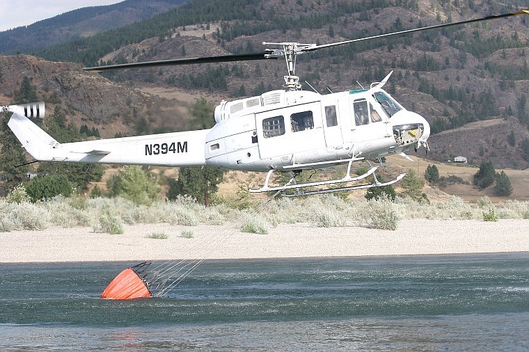 &lt;p&gt;A helicopter scoops water out of the Clark Fork River Sunday to go dump on the fire up the mountain.&#160;&lt;/p&gt;