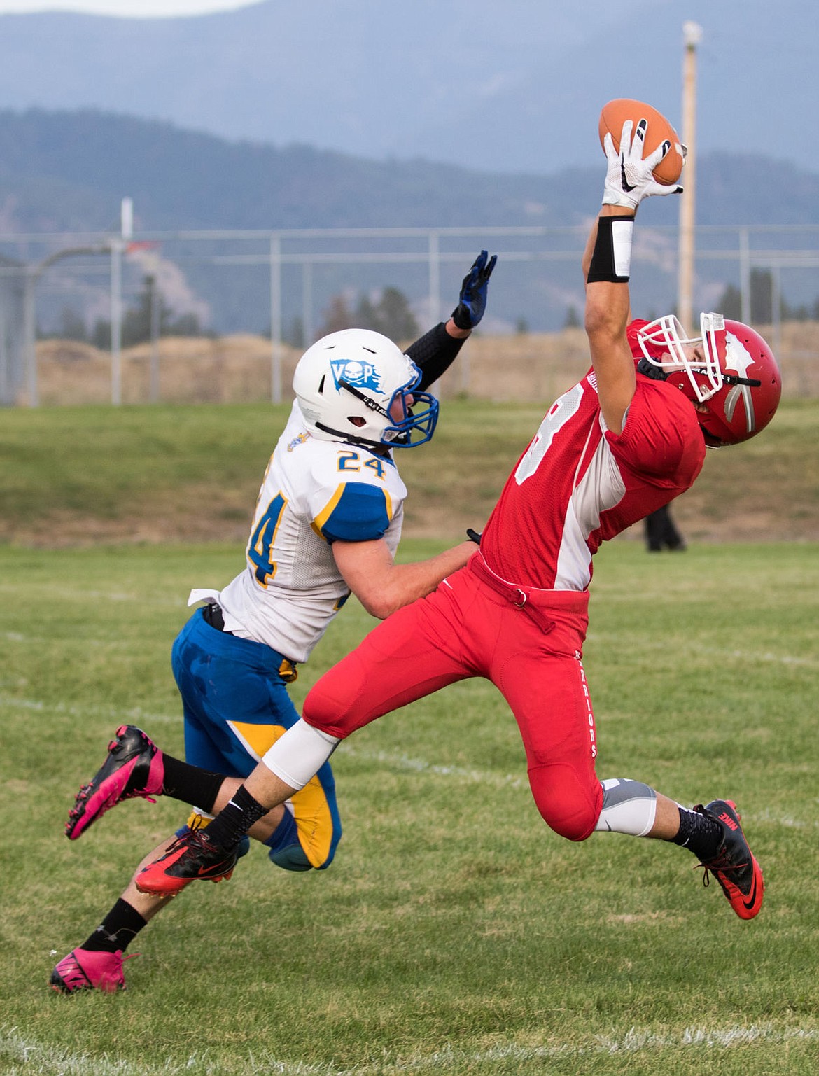 &lt;p&gt;Arlee's Tyler Tanner pulls in a catch over a Victor defender on Monday evening in Arlee.&lt;/p&gt;