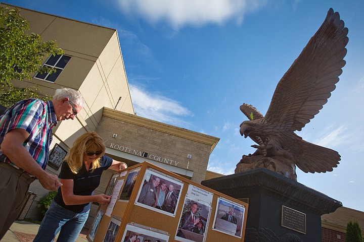 &lt;p&gt;Tony Stewart and Christie Wood, both with the Kootenai County Task Force on Human Relataions, make the final touches to a display Friday commemorating the tenth anniversary of the organization's trial win over the Aryan Nations.&lt;/p&gt;