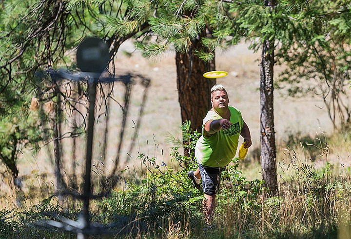 &lt;p&gt;SHAWN GUST/Press&lt;/p&gt;&lt;p&gt;Corey Kupperman, of Coeur d&#146;Alene, tosses a frisbee toward the 8th basket of the Cherry Hill disc golf course Thursday while playing the course with his father.&lt;/p&gt;