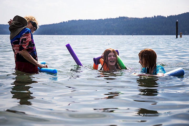 &lt;p&gt;TESS FREEMAN/Press&lt;/p&gt;&lt;p&gt;Elizabeth Hoerner, 12,&#160;right, Mary Hoerner, 7,&#160;center and their grandmother Miriam McFadden swim in Lake Coeur d&#146;Alene on Tuesday afternoon. Temperatures are expected to drop below 80 degrees for the rest of the week in Coeur d&#146;Alene.&lt;/p&gt;