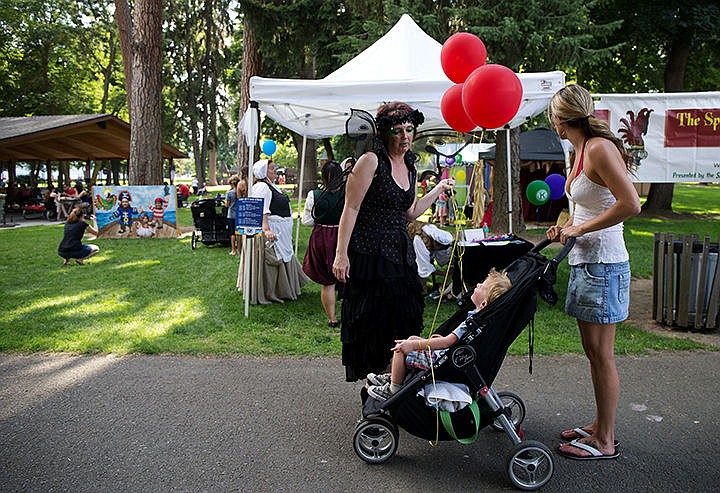 &lt;p&gt;TESS FREEMAN/Press&lt;/p&gt;&lt;p&gt;Tiffani Bartel&#160;and her son Austin Bartel, 3, of Hayden&#160;stop to talk to Lena Cooley&#160;about the kids activities at the Taste of Coeur d&#146;Alene this weekend. The Kiwanis of the Idaho Panhandle provided free activities for kids at the Taste of Coeur d&#146;Alene.&lt;/p&gt;