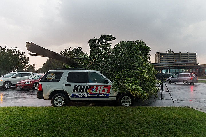 &lt;p&gt;SHAWN GUST/Press&lt;/p&gt;&lt;p&gt;A tree rests on top of a KHQ news vehicle after being blown over in the parking lot near Independence Point Tuesday during a storm that brought heavy winds and rains through Coeur d&#146;Alene.&lt;/p&gt;