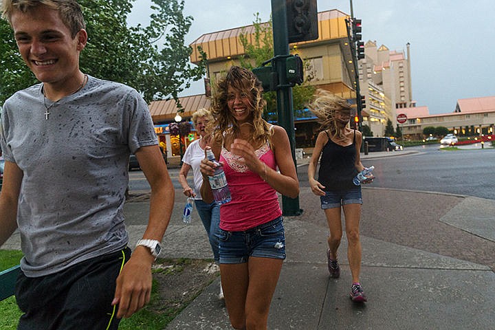 &lt;p&gt;SHAWN GUST/Press&lt;/p&gt;&lt;p&gt;From left, Stephen Bottoms, Shirley Welker, Katie and Lori Lynch briskly walk along the sidewalk near Second Street after crossing Sherman Avenue Tuesday during a sudden storm in Coeur d&#146;Alene.&lt;/p&gt;